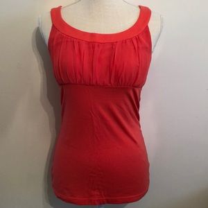 Peach tank top from Express with round neckline and synching at the bust. Size S